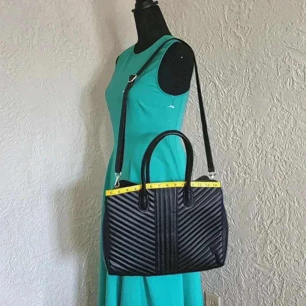 A new day tm.large bag great for laptop 💻 like new use only at few times.